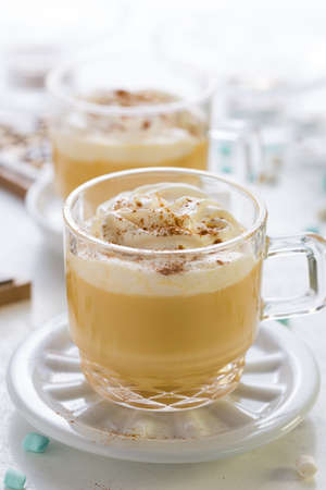 Eggnog with cinnamon and nutmeg  with small tree cookies for Christmas and winter holidays.の写真素材
