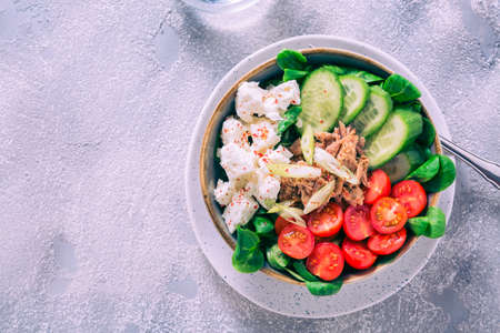 Vegetarian buddha bowl. Raw vegetables and tuna in a one bowl. Vegetarian, healthy, detox food conceptの写真素材