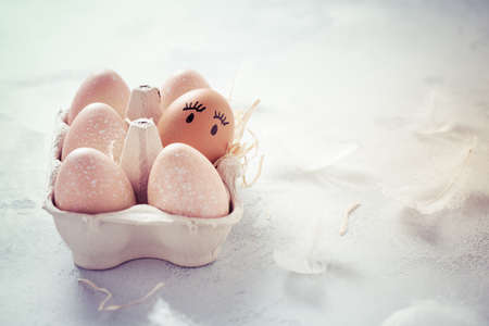 Easter eggs on wooden table. Easter decoration in vintage style with copy spaceの写真素材