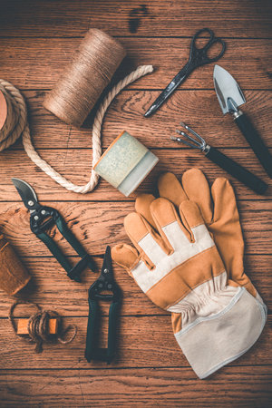 Gardening tools and equipment on wooden backgroundの写真素材