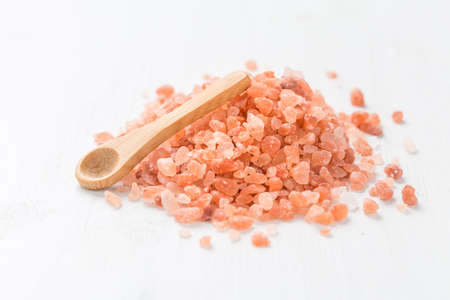 Organic Himalayan with small spoon on white background.の写真素材