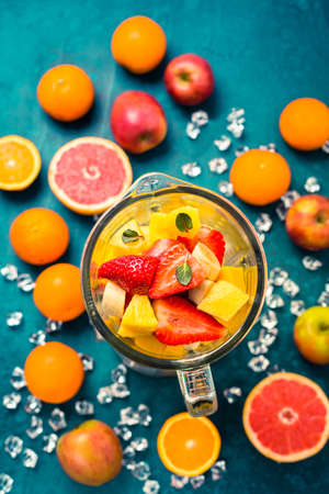 Variation of fruits in mixer. Preparing milkshake or smoothieの写真素材