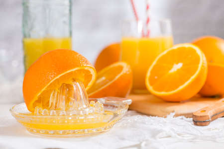 Freshly pressed juice with squeezer for healthy breakfastの写真素材