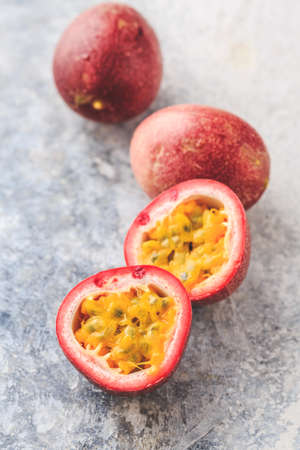 Organic raw passion fruit on kitchen table.の写真素材
