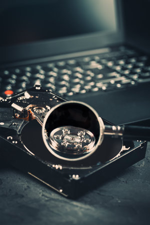 Open Hard drive on keyboard of laptop or notebook in dark toneの写真素材