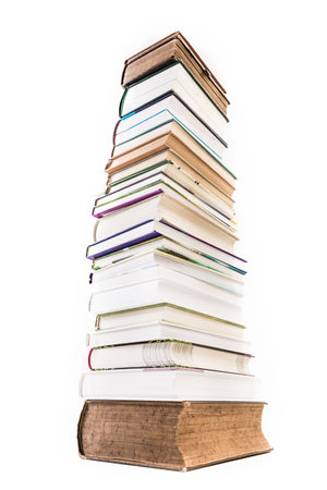 Pile of old and new books isolated on white backgroundの写真素材