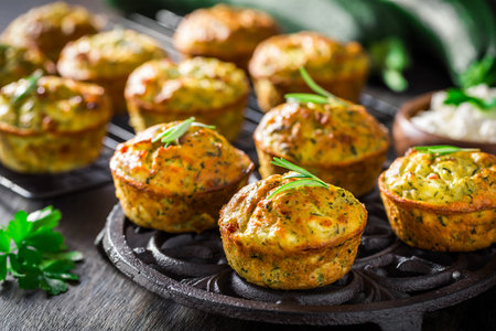 Homemade zucchini muffins with feta cheese, savory courgette with ingredientsの写真素材