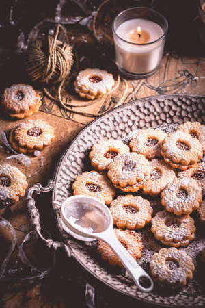Homemade Christmas cookies with candles in white vintage styleの写真素材