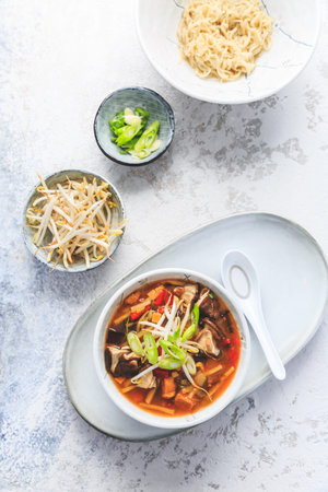 Asian soup with shiitake mushrooms, noodles, vegetables and bamboo sprouts