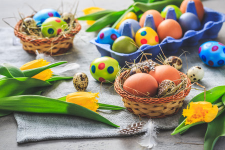 Spring time - Easter eggs and tulips on grey background