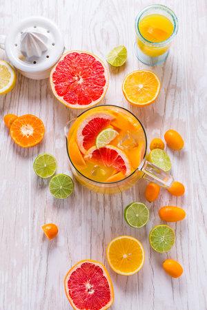 Citrus lemonade or ice tea. Drink with fresh lemons and oranges. Lemon cocktail with juice and iceの写真素材