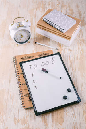 Time managament concept in office. Books, notepads with To-Do listの写真素材