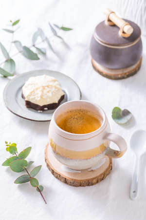 Coffee break - cup of coffee with sweet cake or cookieの写真素材