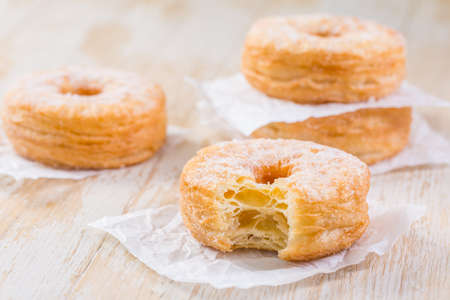 Cronuts - delicious fusion of croissant and donut. Half-donut and half-croissant pastryの写真素材