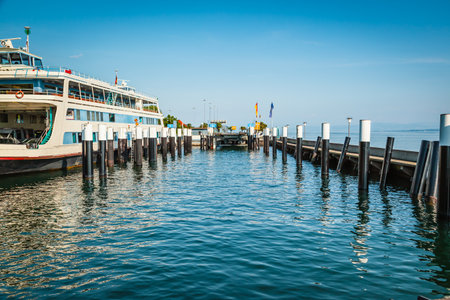 Ferry coming to port for loading or unloading by a port pierの写真素材