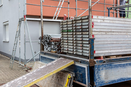 Modern house under construction with scaffold pole platform. New build domestic buildingの写真素材