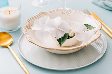 Spring shabby chic table setting, plate decorated with flowersの写真素材