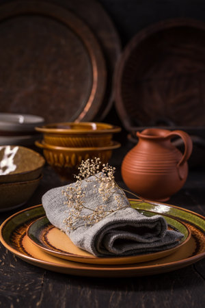 Set of kitchen ceramic and wooden tableware a table. Eco style home still life.  Vintage styleの写真素材