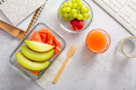 Healthy snack at office workplace, organic vegan meals from take away lunch boxの写真素材