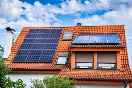 Photovoltaic panels on the roof of family house, solar panels. Environment and technology concepts.の写真素材