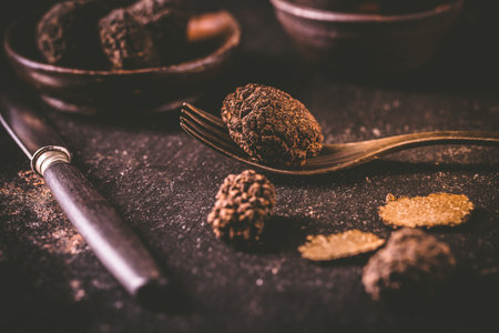 Expensive black truffles gourmet mushrooms  on kitchen tableの写真素材