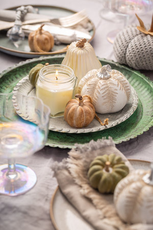 Autumn table setting with pumpkins. Thanksgiving holiday dinner and fall decorationの写真素材