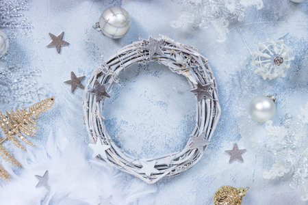 Making Christmas wreath with assorted ornaments, balls in white and silver colorの写真素材