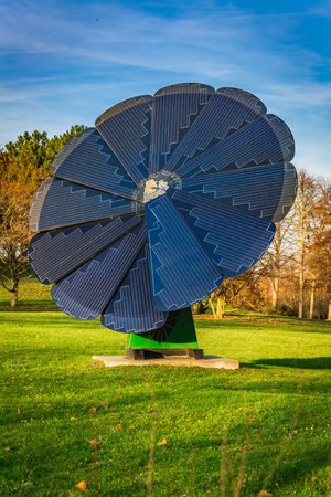 Rotating solar panel in flower shape in a city park. Photovoltaic, alternative electricity sourceの写真素材