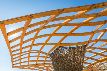 Detail of a modern wooden architecture, wooden roof, openwork design