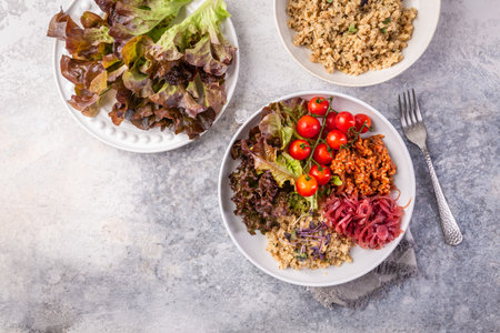 Ketogenic, paleo diet lunch bowl with grilled meat, cauliflower rice and mixed saladの写真素材