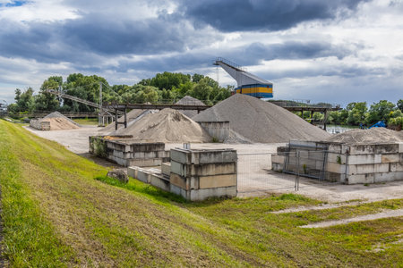 Gravel quarry, plant - industrial stone production, industrial plant with belt conveyor in open pit miningの写真素材