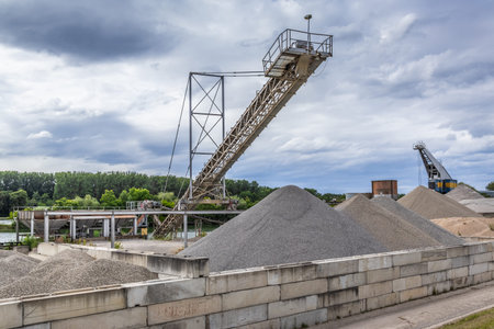 Gravel quarry, plant - industrial stone production, industrial plant with belt conveyor in open pit...