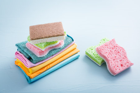 Assortment of different sponges and cleaning rags, with fiber cloth and duster microfiber clothの写真素材