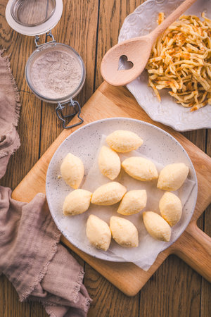 Semolina dumplings and pancake noodles for soup, broth preparing with noodlesの写真素材