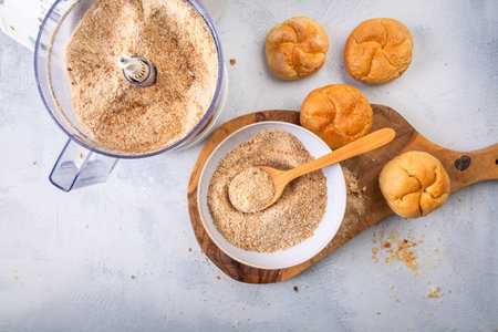 Making homemade panko and breadcrumbs from leftover bread and buns, zero waste conceptの写真素材