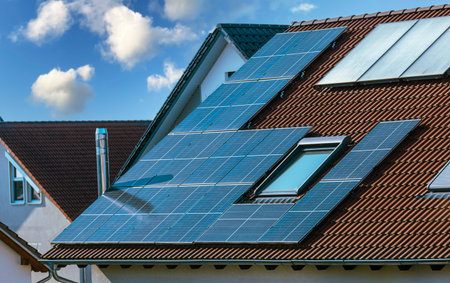 Photovoltaic panels on the roof of family house, solar panels. Environment and technology concepts.