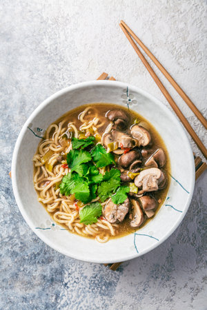 Asian vegan miso ramen noodle soup with mushrooms, onions and cilantroの写真素材
