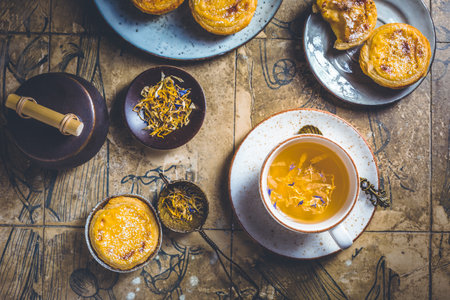 Pastel de nata with cup of herbal tea, Portugal sweet egg and pudding pastryの写真素材