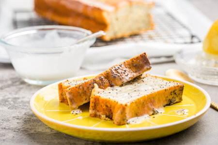 Lemon poppy cake with sugar sweet icing, lemon pound cake loafの写真素材