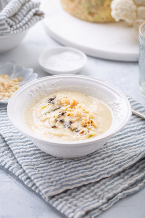 Vegetarian cauliflower soup with truffle and macadamia nutsの写真素材
