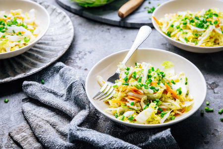 Chinese cabbage salad with carrots and green onionsの写真素材