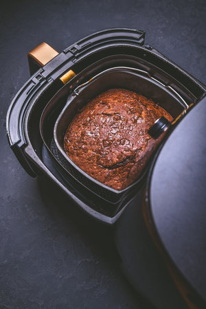 Cooking and baking in airfryer - homemade brownies cake with chocolate chipsの写真素材