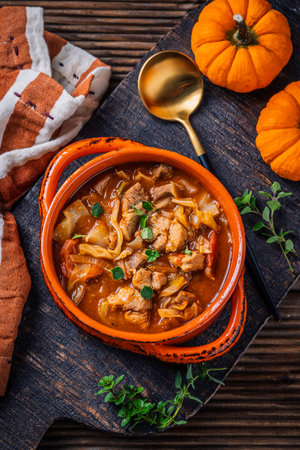 Warm stew with meat, cabbage and pumpkin, comfort autumn dinner balanced foodの写真素材