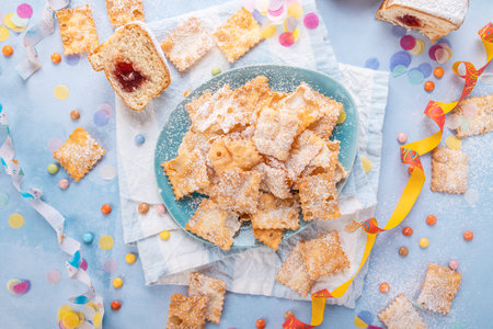 Carnival and party snack with confetti, ribbon and party accessoriesの写真素材