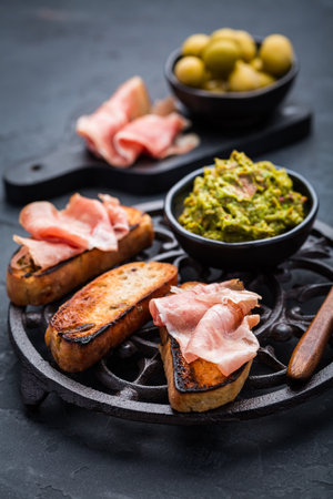 Fried bread, substitute for toast, savory French toast with avocado spread and Serrano hamの写真素材