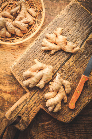 Fresh organic ginger roots on wooden background.の写真素材