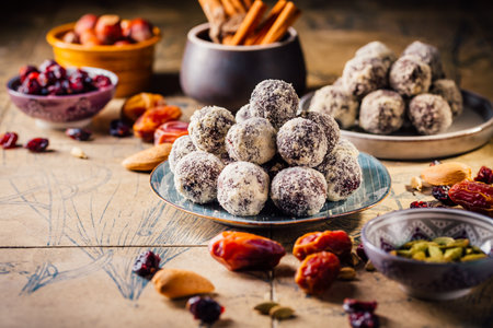 Energy vegan balls - raw dessert (bliss balls),  sugar free candies with ingredients, nut and fruitsの写真素材