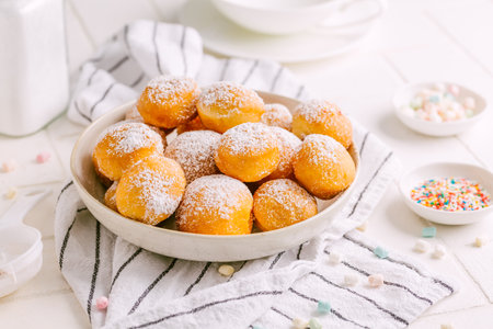 Cottage cheese donuts balls with sugar in a bowl. Healthy curd dessert.の写真素材