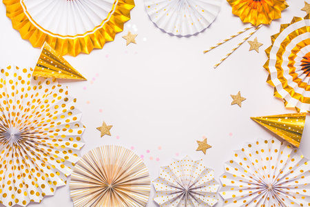Party  background with paper fans, party decoration, party celebration in white and golden toneの写真素材