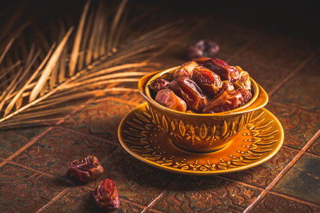 Dried  organic dates in bowl on old kitchen tableの写真素材